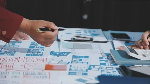 The designer team is designing the uxui system to make the uxui system work.. Stock Footage 290953218