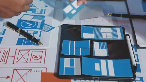 The designer team is designing the uxui system to make the uxui system work.. Stock Footage 290953285