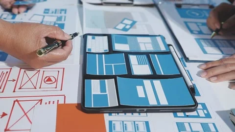 The designer team is designing the uxui system to make the uxui system work.. Stock Footage 290953319