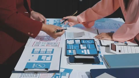 The designer team is designing the uxui system to make the uxui system work.. Stock Footage 290953512