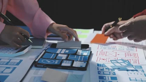 The designer team is designing the uxui system to make the uxui system work.. Stock Footage 290953515