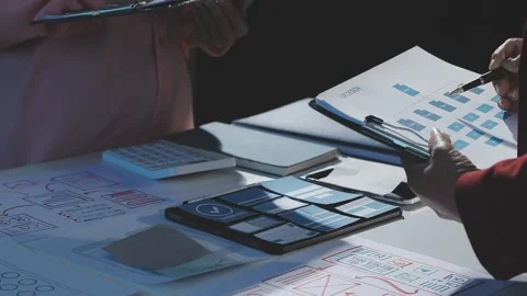 The designer team is designing the uxui system to make the uxui system work.. Stock Footage 290953544