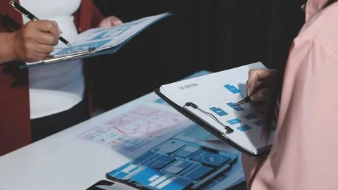 The designer team is designing the uxui system to make the uxui system work.. Stock Footage 290953574