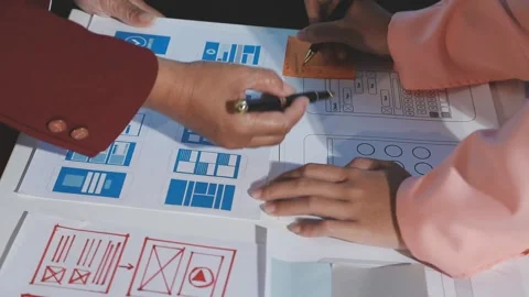 The designer team is designing the uxui system to make the uxui system work.. Stock Footage 290953678