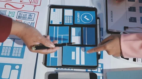 The designer team is designing the uxui system to make the uxui system work.. Stock Footage 290953762