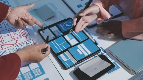 The designer team is designing the uxui system to make the uxui system work.. Stock Footage 290953852
