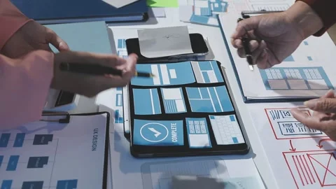 The designer team is designing the uxui system to make the uxui system work.. Stock Footage 290954026