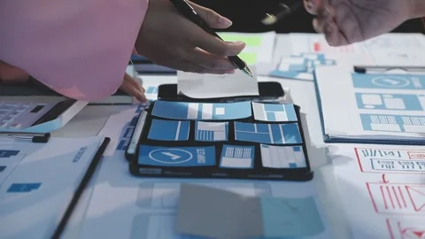 The designer team is designing the uxui system to make the uxui system work.. Stock Footage 290954033