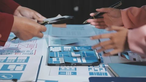 The designer team is designing the uxui system to make the uxui system work.. Stock Footage 290954044