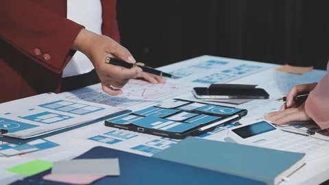 The designer team is designing the uxui system to make the uxui system work.. Stock Footage 290954069