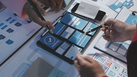 The designer team is designing the uxui system to make the uxui system work.. Stock Footage 290958730