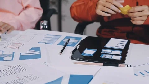 The designer team is designing the uxui system to make the uxui system work.. Stock Footage 308982600