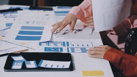 The designer team is designing the uxui system to make the uxui system work.. Stock Footage 308982605