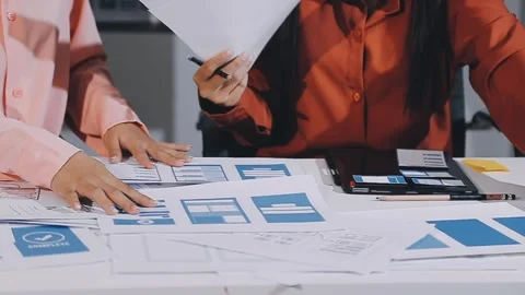 The designer team is designing the uxui system to make the uxui system work.. Stock Footage 308982608