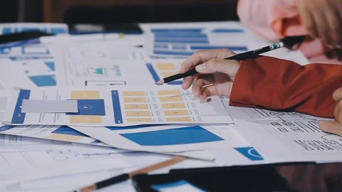 The designer team is designing the uxui system to make the uxui system work.. Stock Footage 308982618