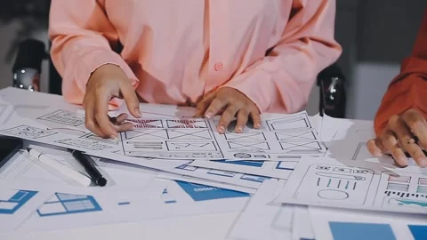 The designer team is designing the uxui system to make the uxui system work.. Stock Footage 308982634