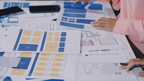 The designer team is designing the uxui system to make the uxui system work.. Stock Footage 308982638