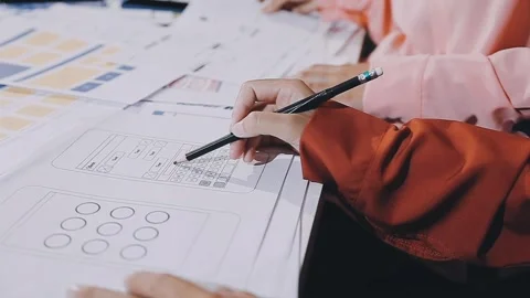 The designer team is designing the uxui system to make the uxui system work.. Stock Footage 308982643
