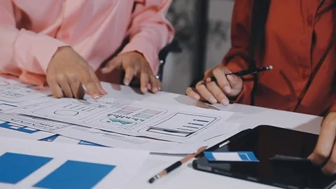 The designer team is designing the uxui system to make the uxui system work.. Stock Footage 308982646