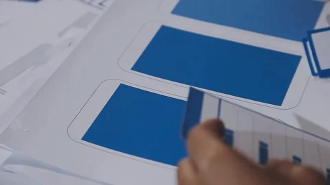 The designer team is designing the uxui system to make the uxui system work.. Stock Footage 308982650