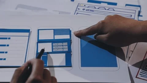 The designer team is designing the uxui system to make the uxui system work.. Stock Footage 308982666