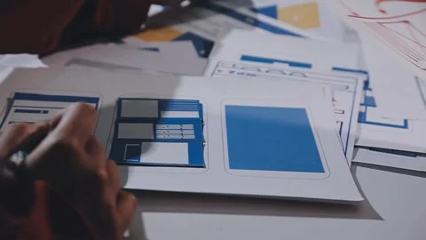 The designer team is designing the uxui system to make the uxui system work.. Stock Footage 308982667
