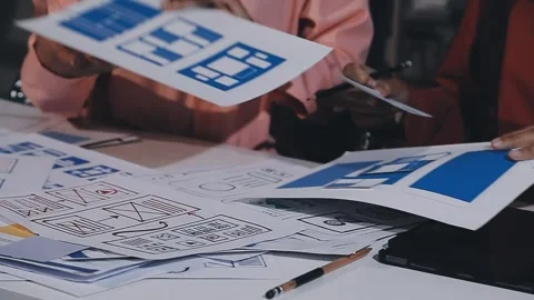 The designer team is designing the uxui system to make the uxui system work.. Stock Footage 308982672