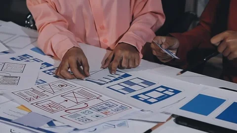 The designer team is designing the uxui system to make the uxui system work.. Stock Footage 308982676