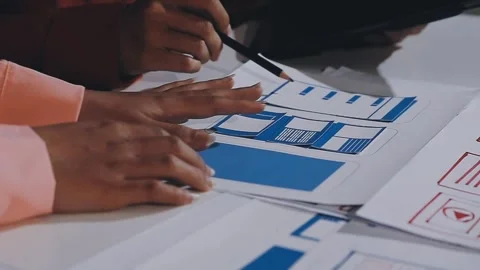 The designer team is designing the uxui system to make the uxui system work.. Stock Footage 308982677