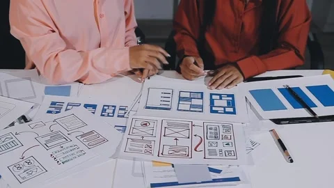 The designer team is designing the uxui system to make the uxui system work.. Stock Footage 308982679