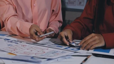 The designer team is designing the uxui system to make the uxui system work.. Stock Footage 308982680