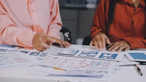 The designer team is designing the uxui system to make the uxui system work.. Stock Footage 308982683
