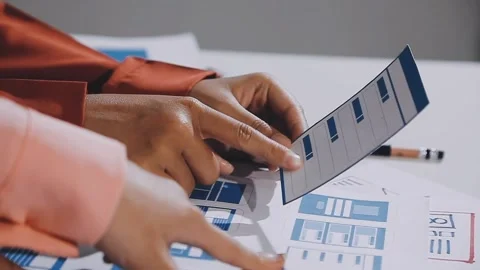 The designer team is designing the uxui system to make the uxui system work.. Stock Footage 308982696