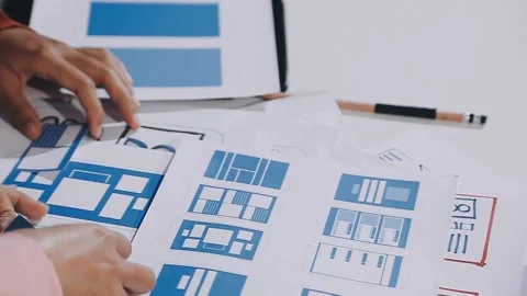 The designer team is designing the uxui system to make the uxui system work.. Stock Footage 308982701