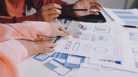 The designer team is designing the uxui system to make the uxui system work.. Stock Footage 308982705