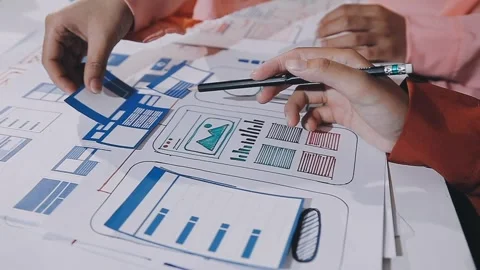 The designer team is designing the uxui system to make the uxui system work.. Stock Footage 308982708