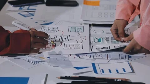 The designer team is designing the uxui system to make the uxui system work.. Stock Footage 308982709