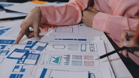 The designer team is designing the uxui system to make the uxui system work.. Stock Footage 308982711