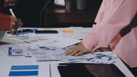 The designer team is designing the uxui system to make the uxui system work.. Stock Footage 308982713