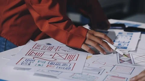 The designer team is designing the uxui system to make the uxui system work.. Stock Footage 308982718