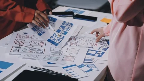 The designer team is designing the uxui system to make the uxui system work.. Stock Footage 308982719