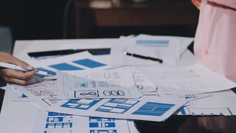 The designer team is designing the uxui system to make the uxui system work.. Stock Footage 308982723