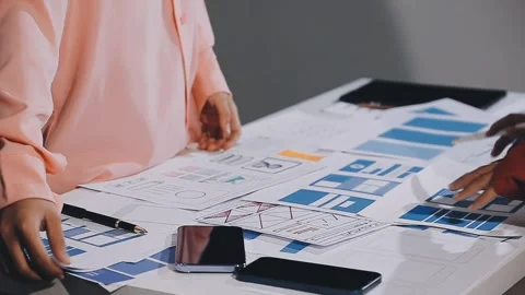 The designer team is designing the uxui system to make the uxui system work.. Stock Footage 308982724