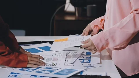 The designer team is designing the uxui system to make the uxui system work.. Stock Footage 308982726