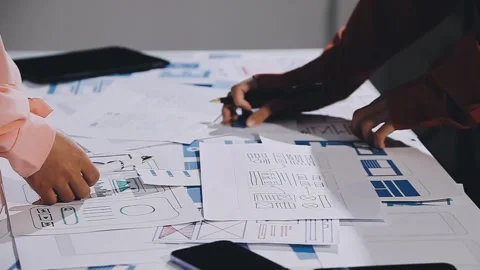 The designer team is designing the uxui system to make the uxui system work.. Stock Footage 308982730