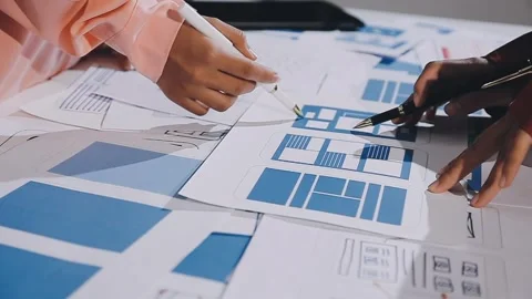 The designer team is designing the uxui system to make the uxui system work.. Stock Footage 308982741