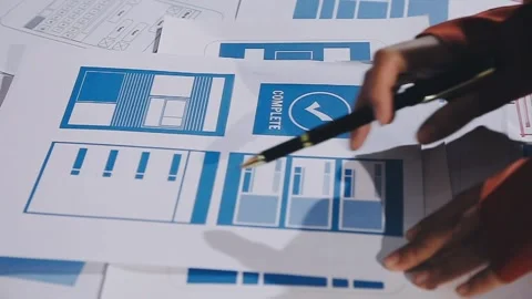 The designer team is designing the uxui system to make the uxui system work.. Stock Footage 308982744