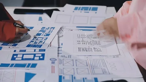 The designer team is designing the uxui system to make the uxui system work.. Stock Footage 308982746