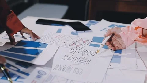 The designer team is designing the uxui system to make the uxui system work.. Stock Footage 308982747