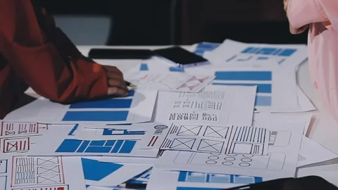 The designer team is designing the uxui system to make the uxui system work.. Stock Footage 308982749